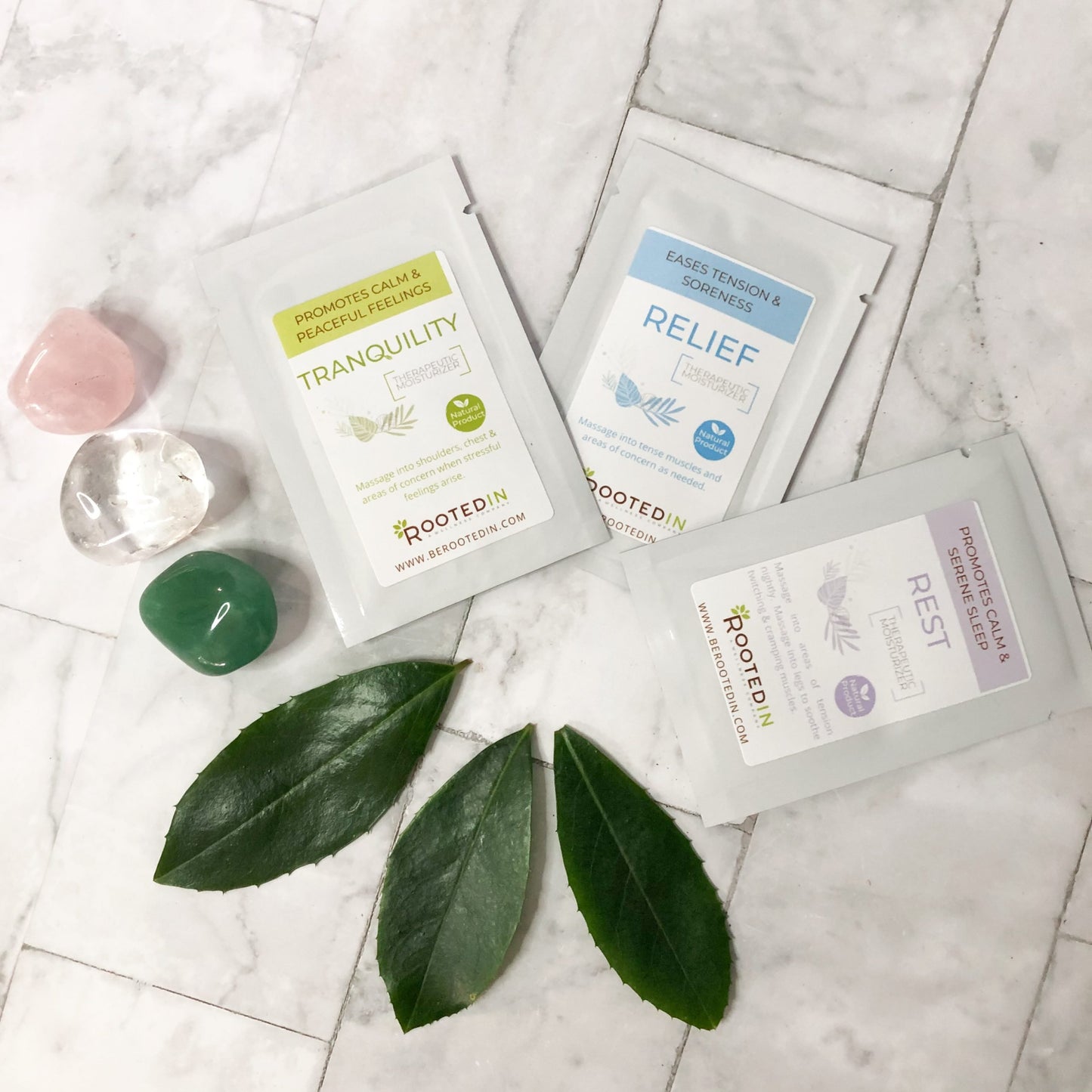 therapeutic magnesium cream samples next to gems and leaves showing luxury and natural healing.
