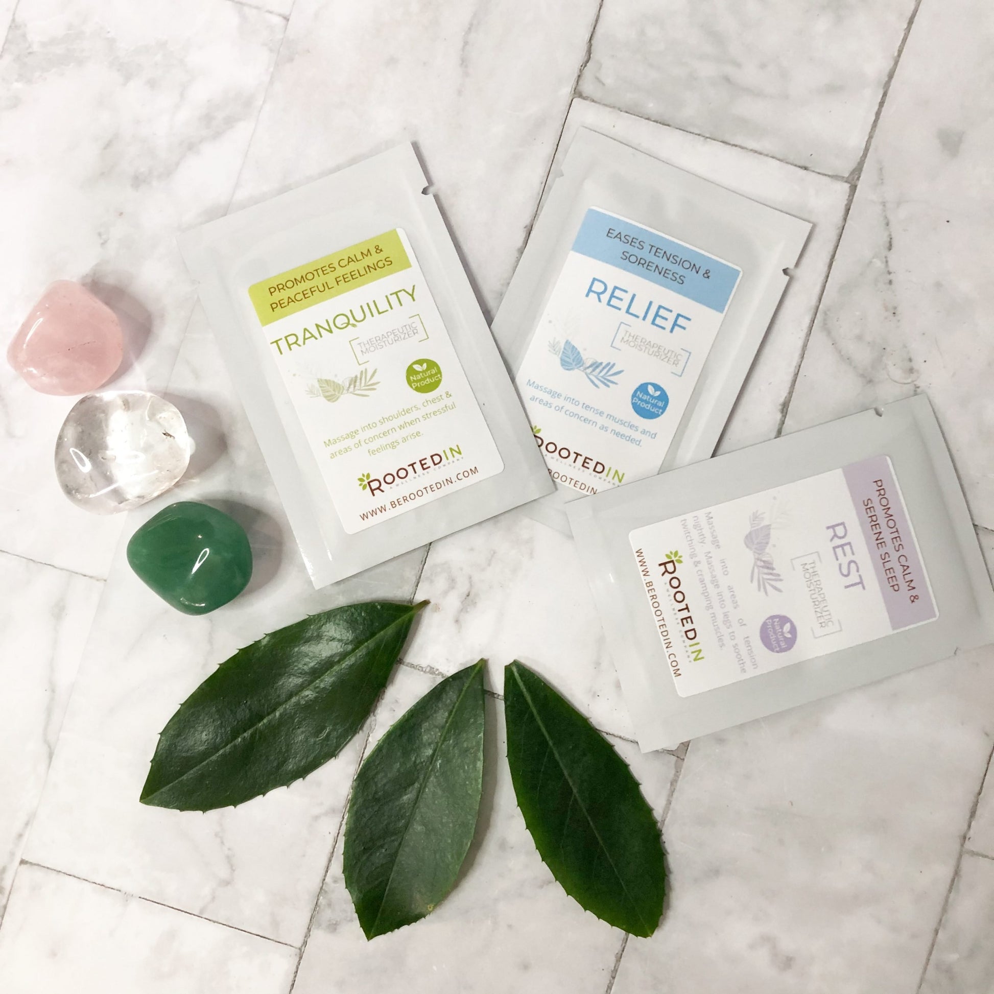 therapeutic magnesium cream samples next to gems and leaves showing luxury and natural healing.